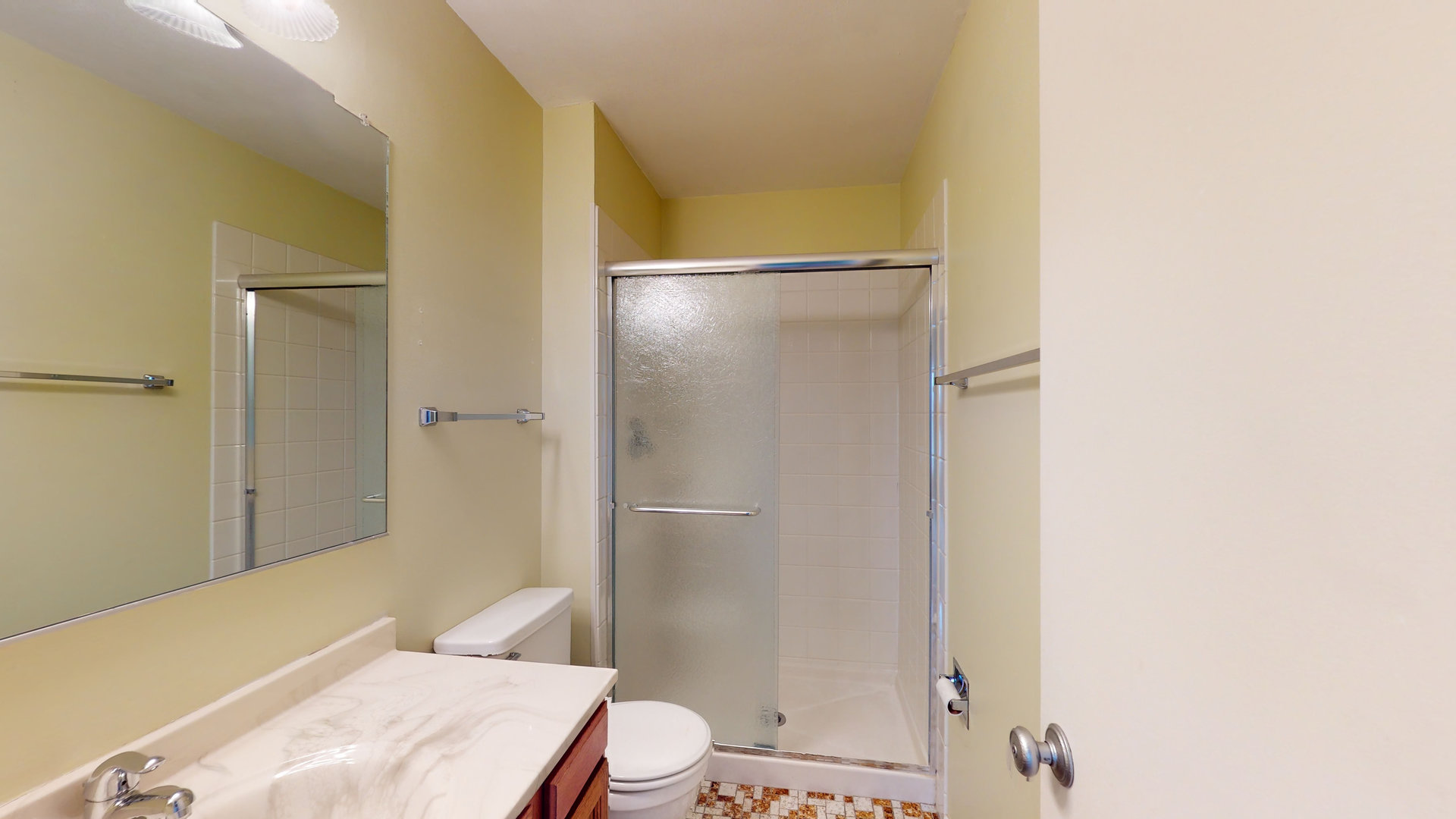 4730 Calvert Drive, Unit B2 Rolling Meadows, IL 60008 - Photo 12 of 20 a bathroom with a granite countertop bathtub shower sink mirror and toilet