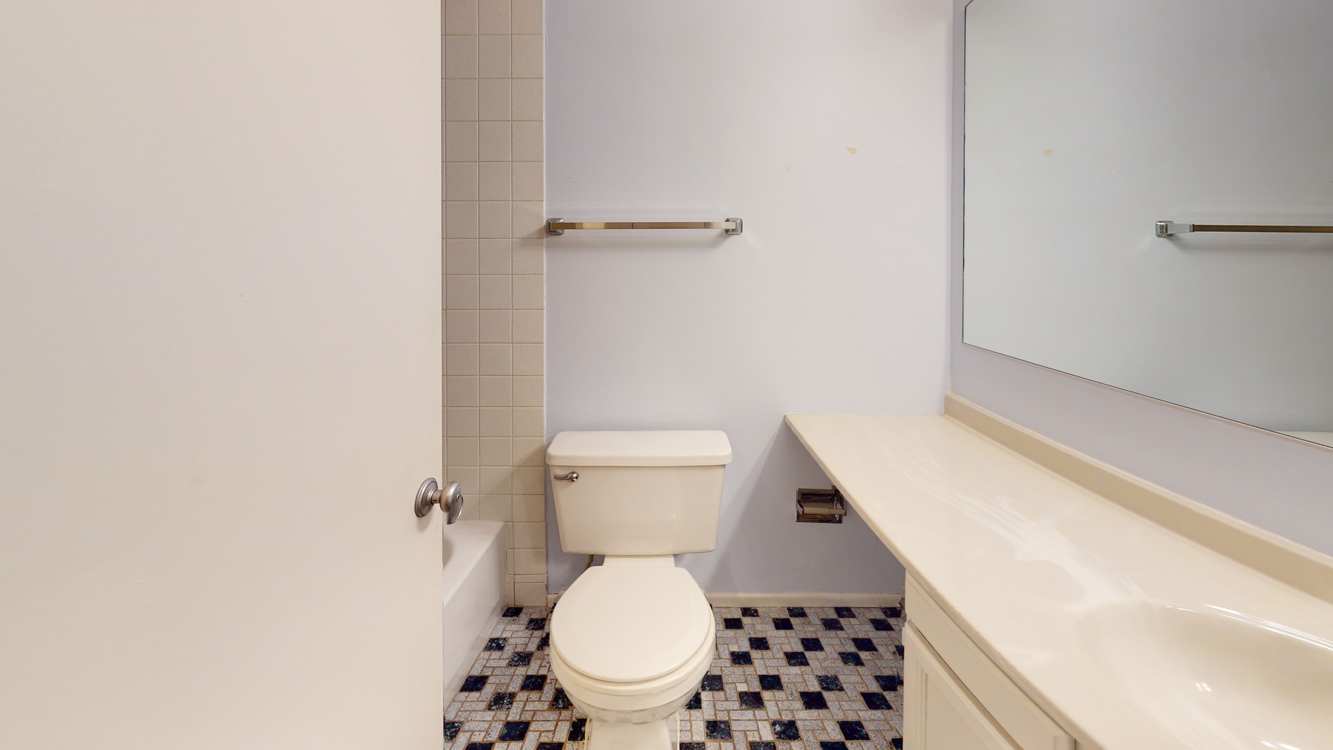 4730 Calvert Drive, Unit B2 Rolling Meadows, IL 60008 - Photo 15 of 20 a white toilet sitting next to a white cabinet