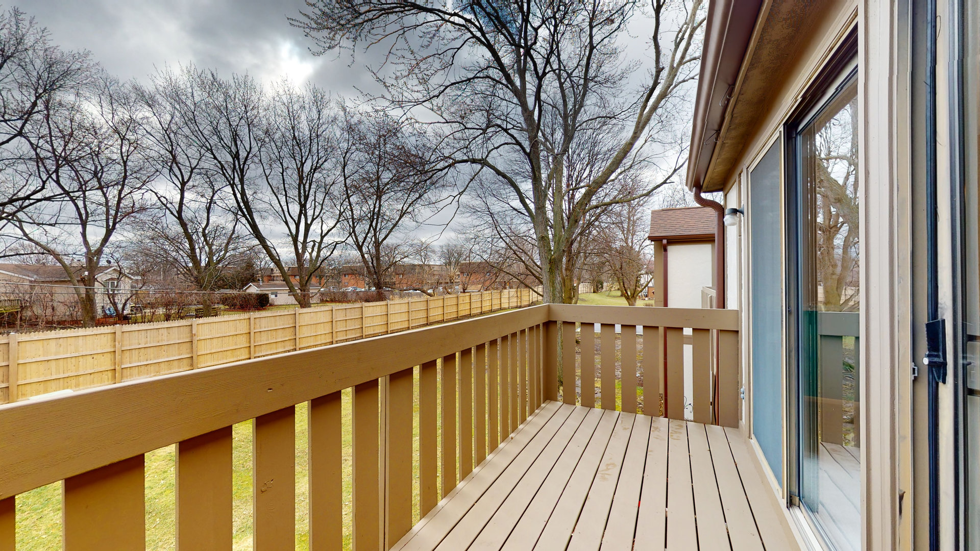 4730 Calvert Drive, Unit B2 Rolling Meadows, IL 60008 - Photo 18 of 20 a view of balcony with wooden floor and fence