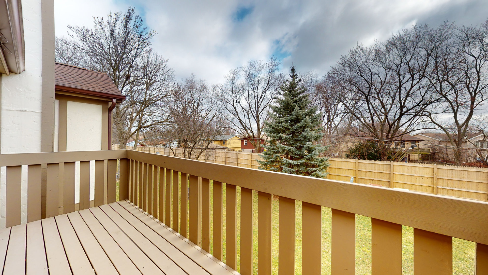 4730 Calvert Drive, Unit B2 Rolling Meadows, IL 60008 - Photo 6 of 20 a view of balcony with wooden floor and fence