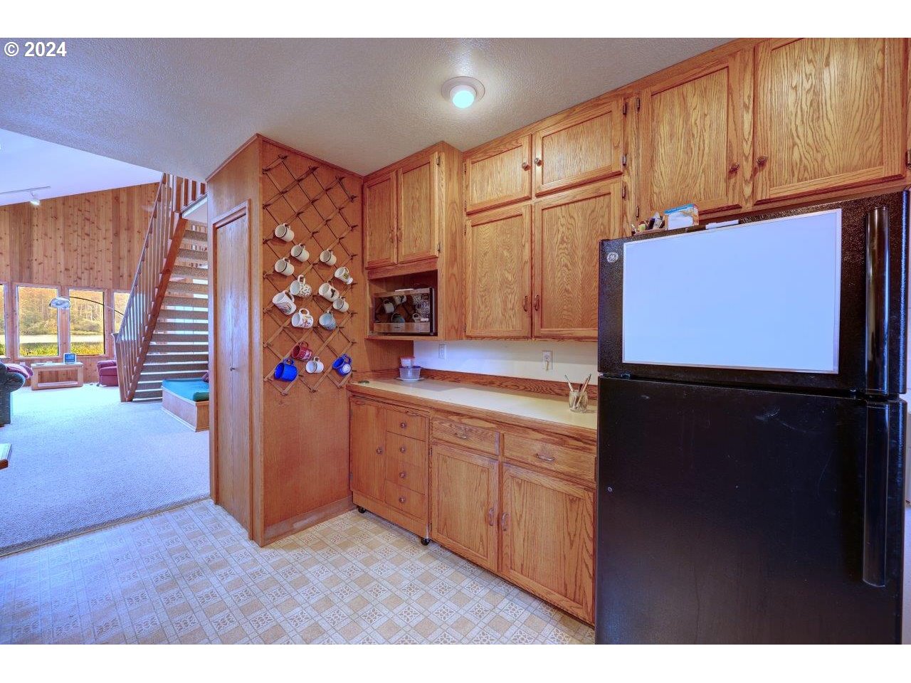 19414 U Street Long Beach, WA 98631 - Photo 24 of 39 a kitchen with stainless steel appliances granite countertop a refrigerator and a sink