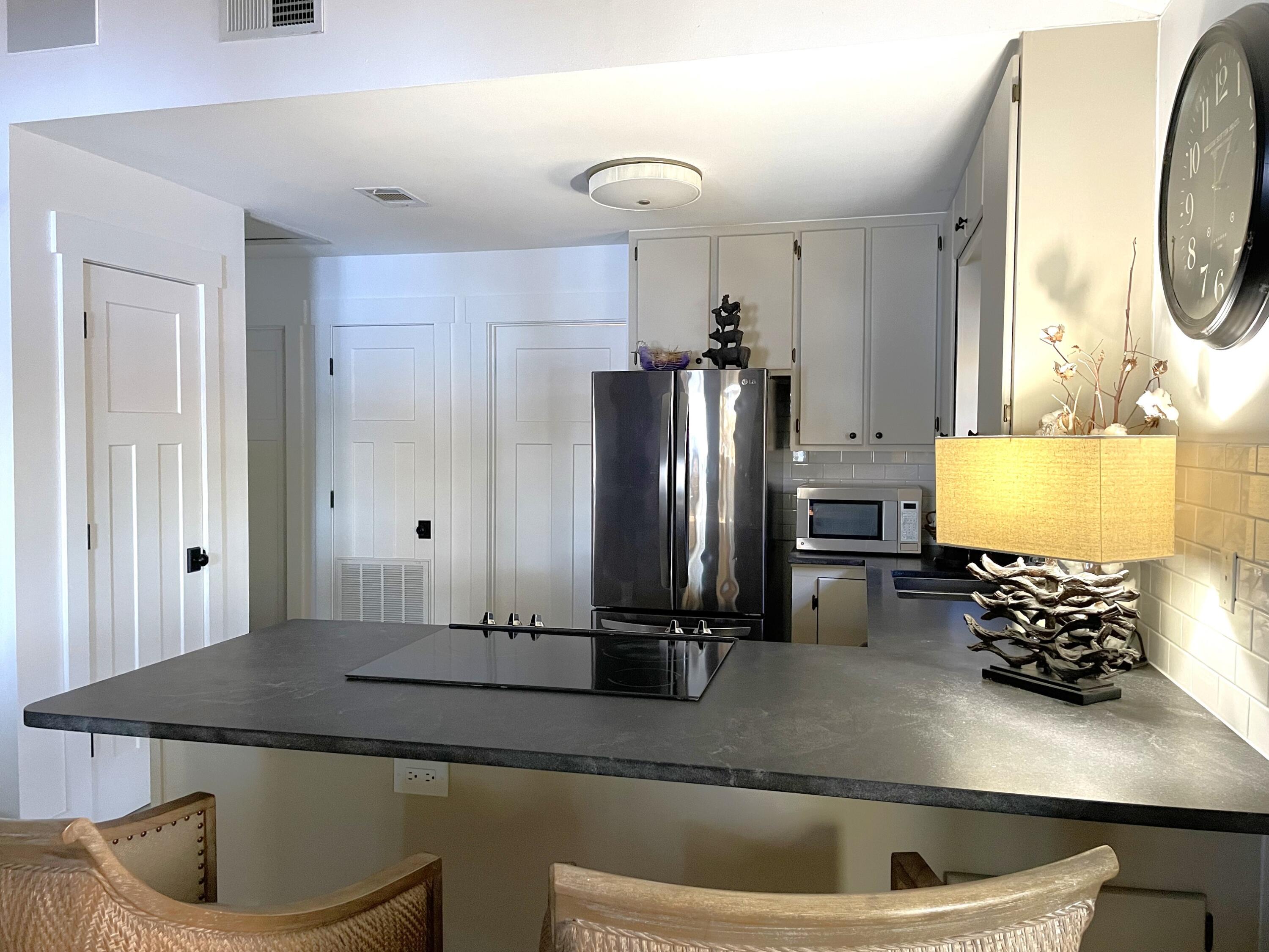 914 Spring Lake Road DeFuniak Springs, FL 32433 - Photo 17 of 78 a kitchen with a refrigerator and a sink
