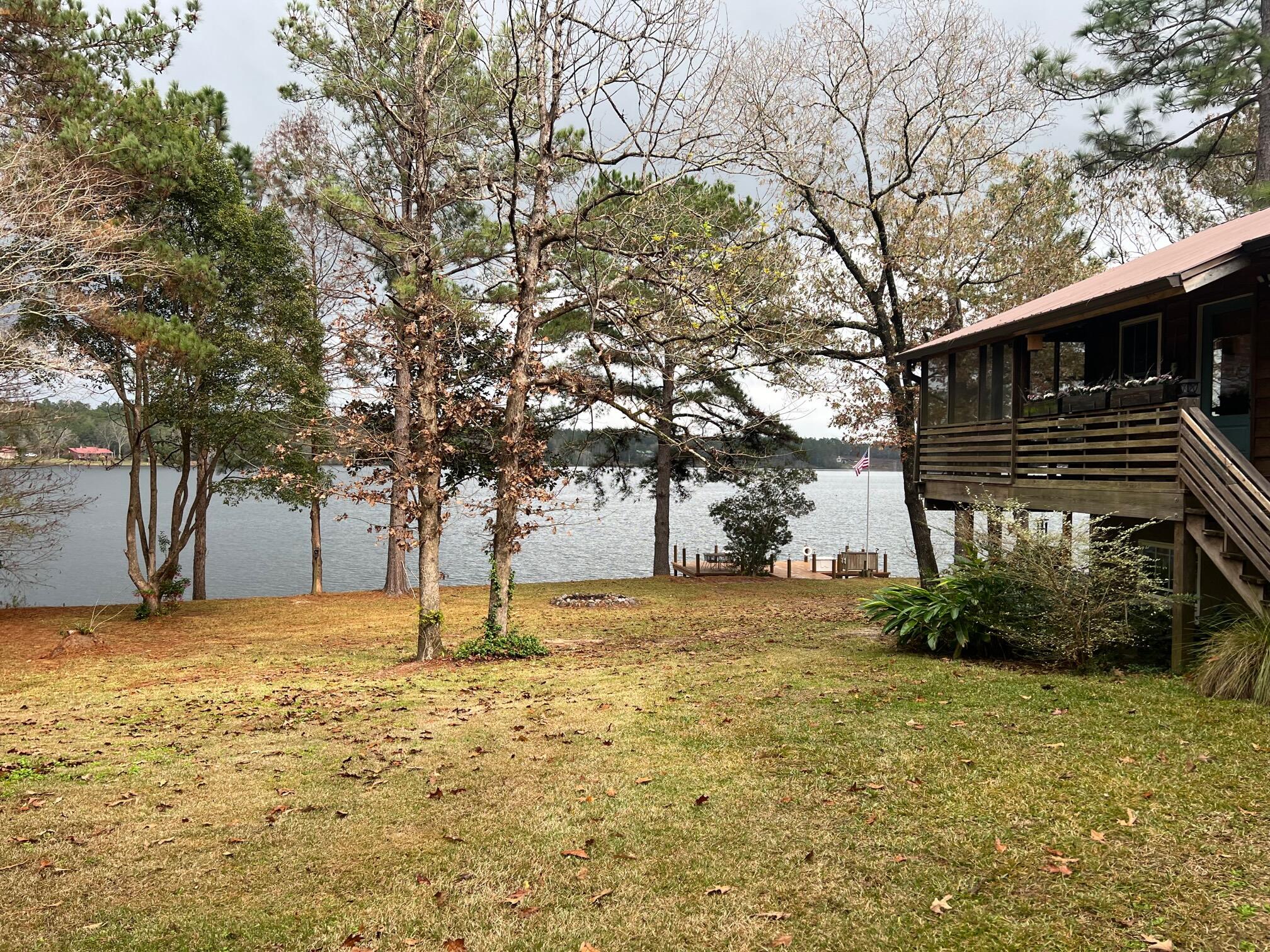 914 Spring Lake Road DeFuniak Springs, FL 32433 - Photo 2 of 78 a backyard of a house with lots of green space