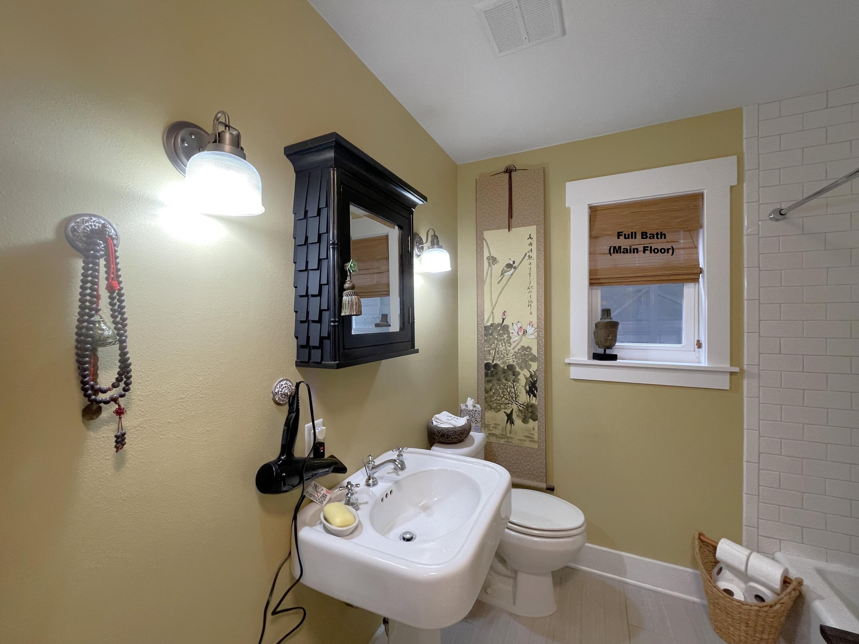 914 Spring Lake Road DeFuniak Springs, FL 32433 - Photo 24 of 78 a bathroom with a sink mirror and toilet
