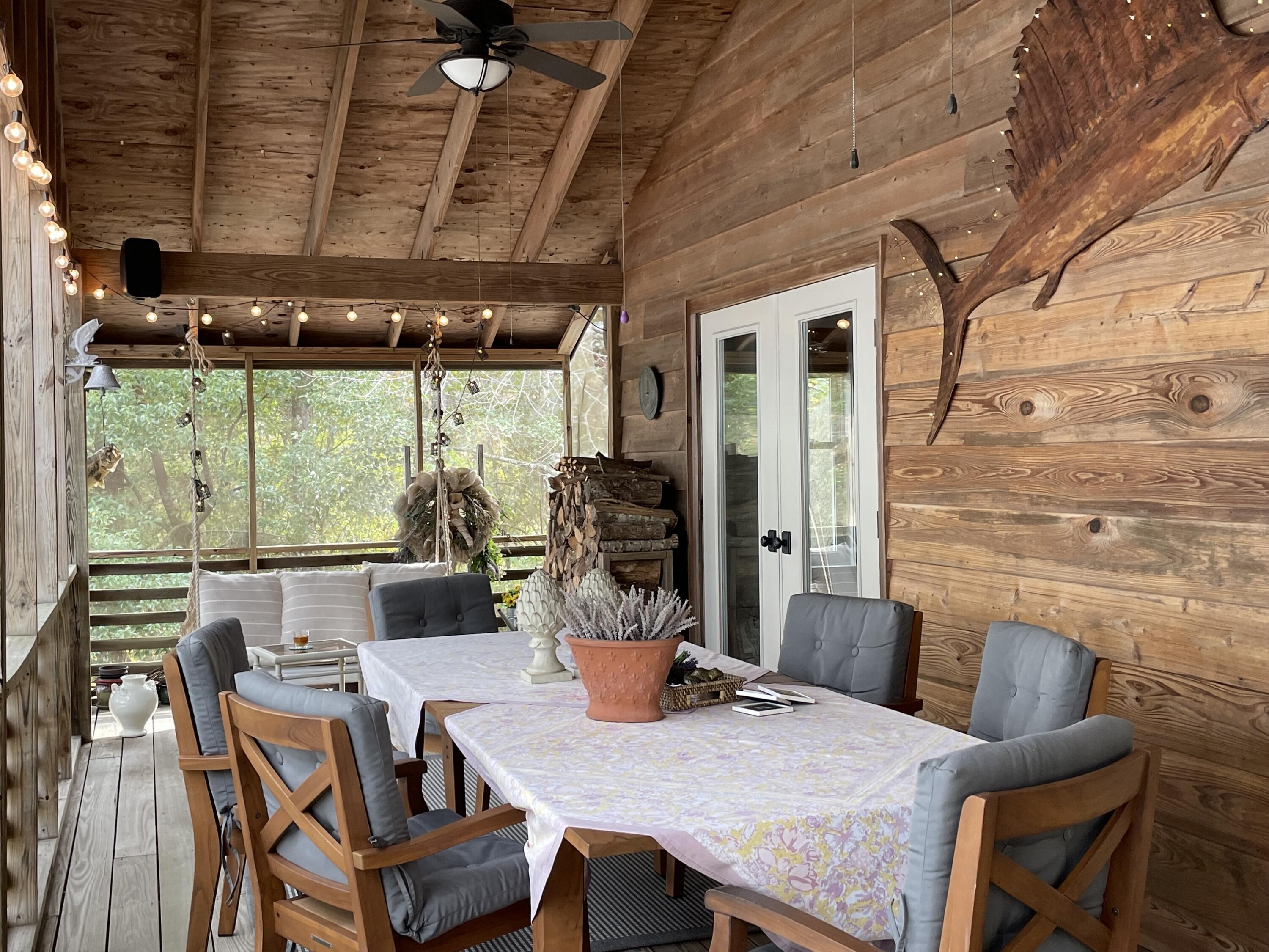 914 Spring Lake Road DeFuniak Springs, FL 32433 - Photo 26 of 78 a view of a dining room with furniture window and outside view