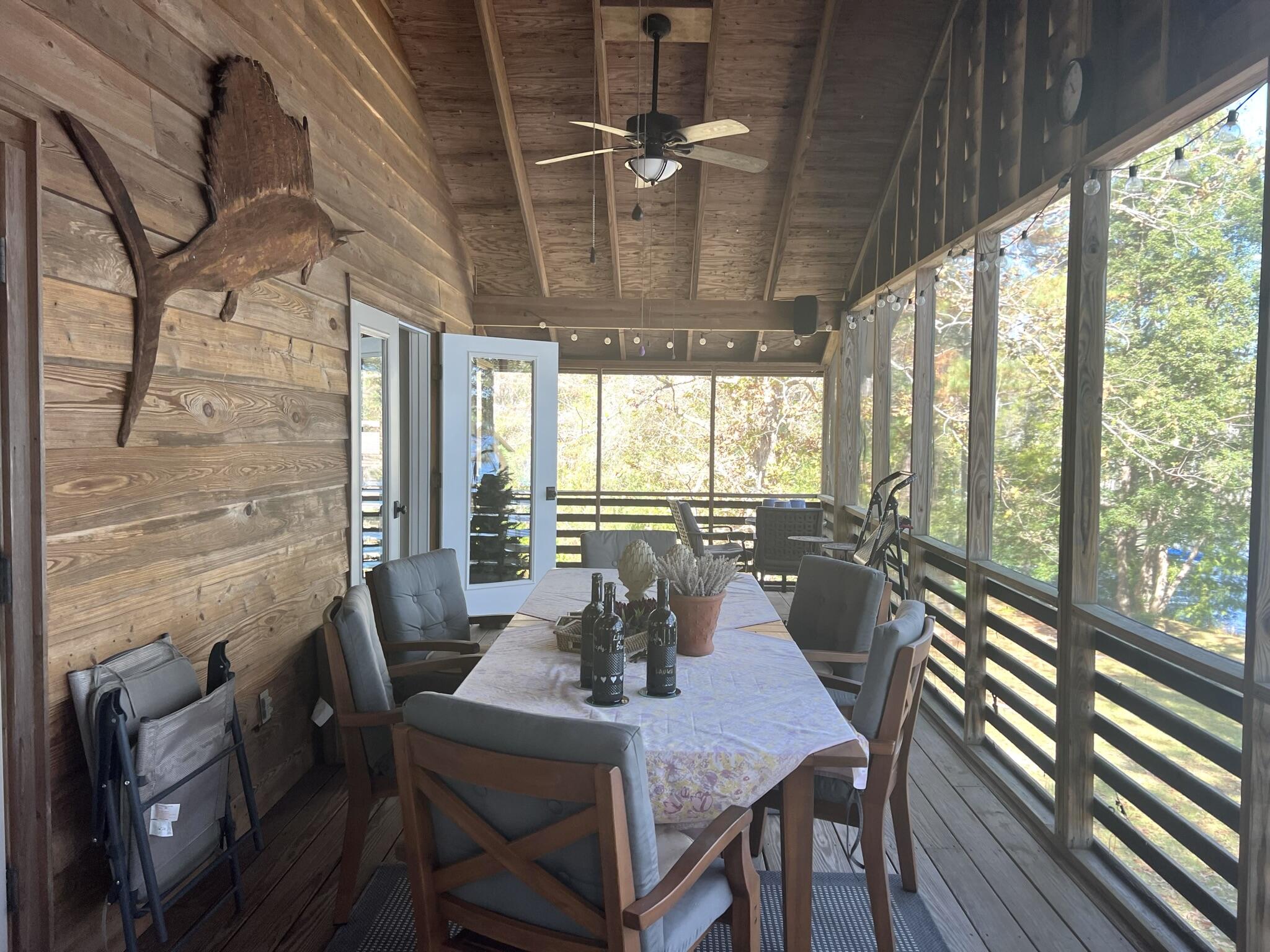 914 Spring Lake Road DeFuniak Springs, FL 32433 - Photo 27 of 78 a view of a dining room with furniture window and outside view