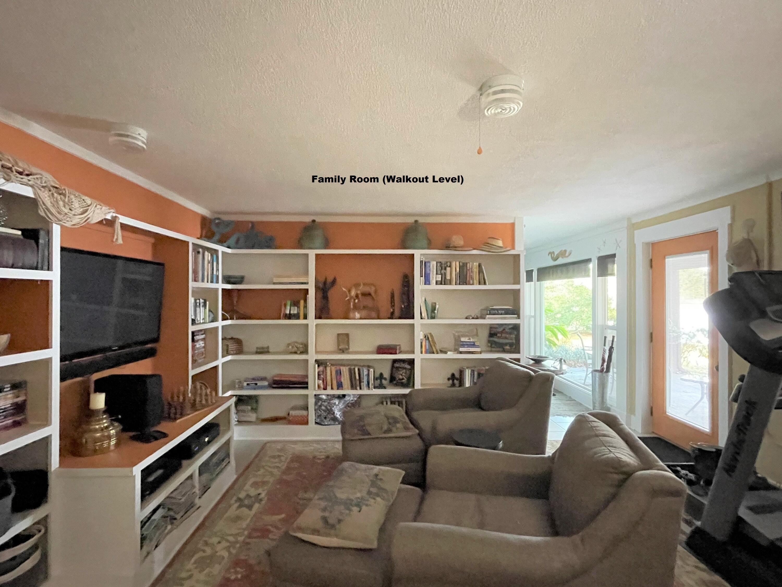 914 Spring Lake Road DeFuniak Springs, FL 32433 - Photo 29 of 78 a living room with furniture a flat screen tv and a window