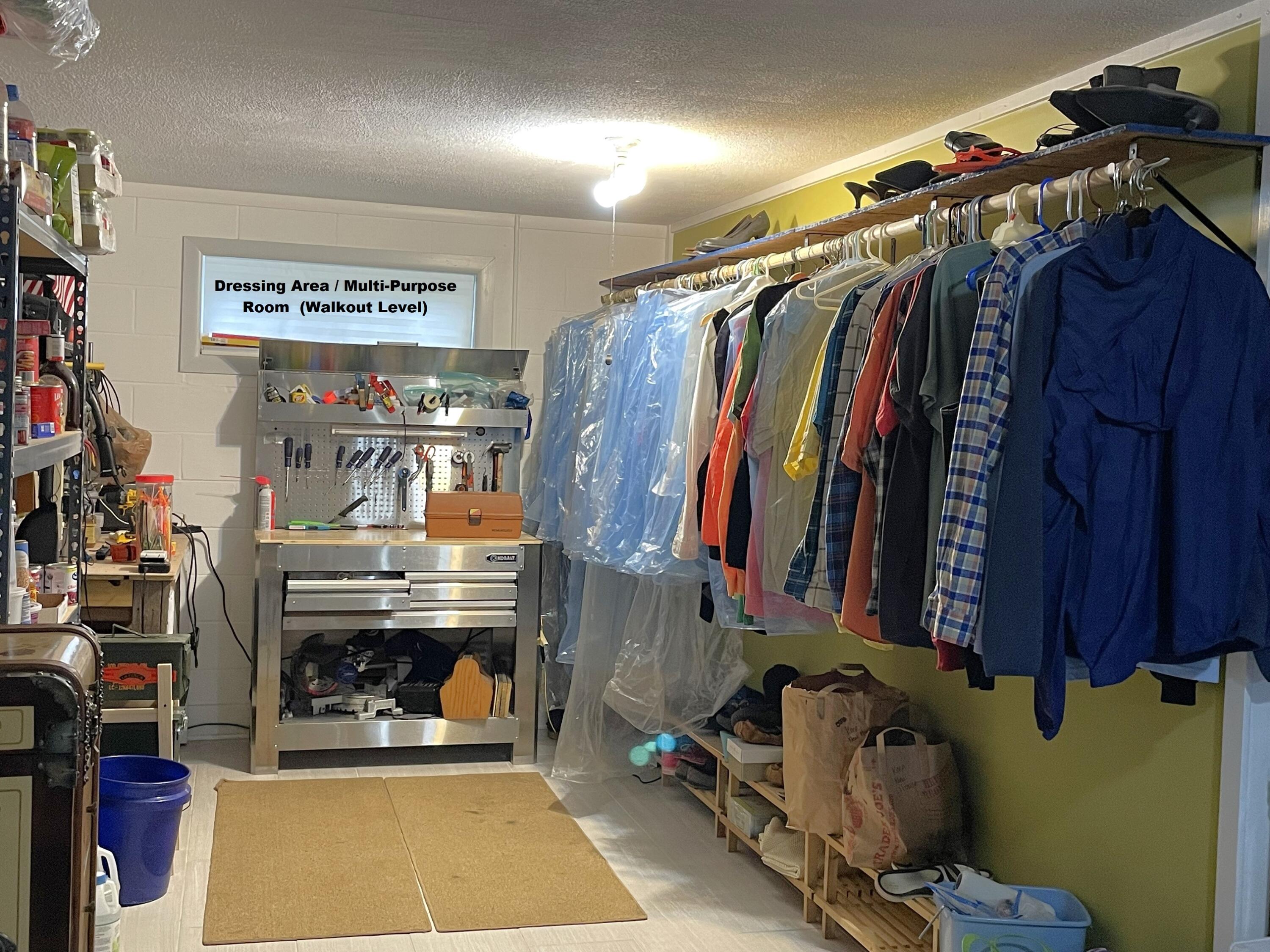 914 Spring Lake Road DeFuniak Springs, FL 32433 - Photo 36 of 78 a view of walk in closet with clothes and shoes