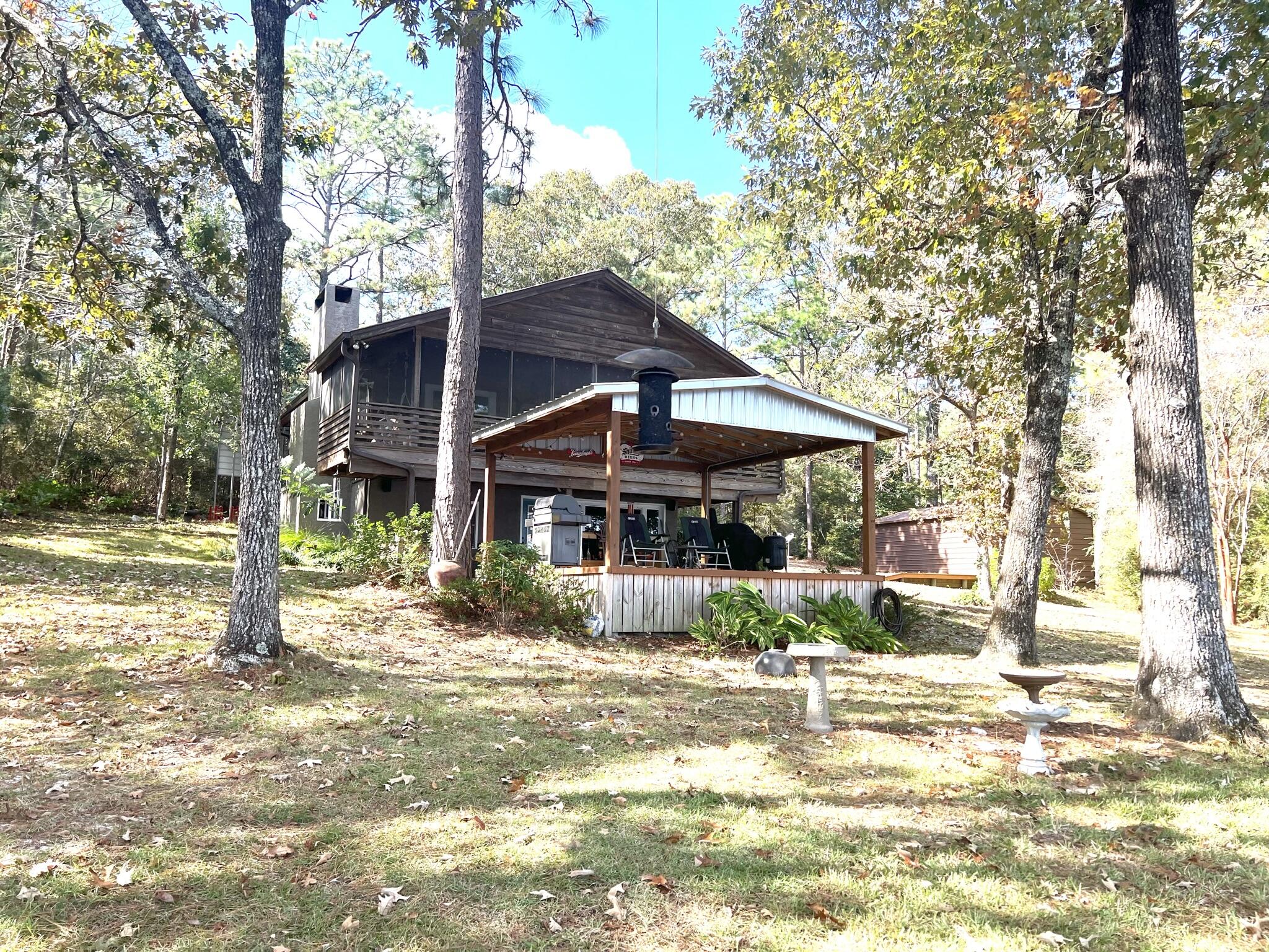 914 Spring Lake Road DeFuniak Springs, FL 32433 - Photo 39 of 78 a front view of a house with a porch