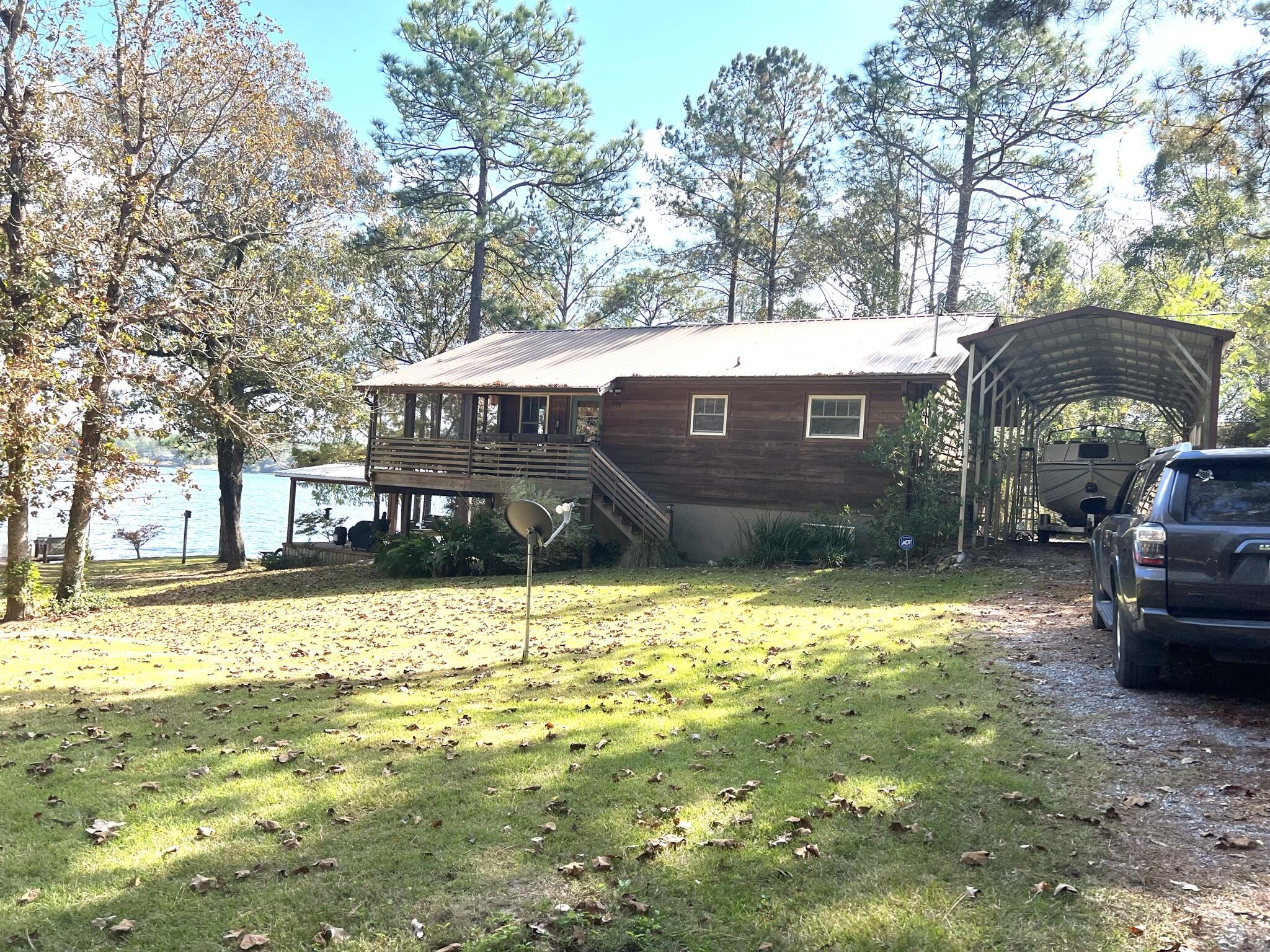 914 Spring Lake Road DeFuniak Springs, FL 32433 - Photo 64 of 78 a front view of a house with a yard