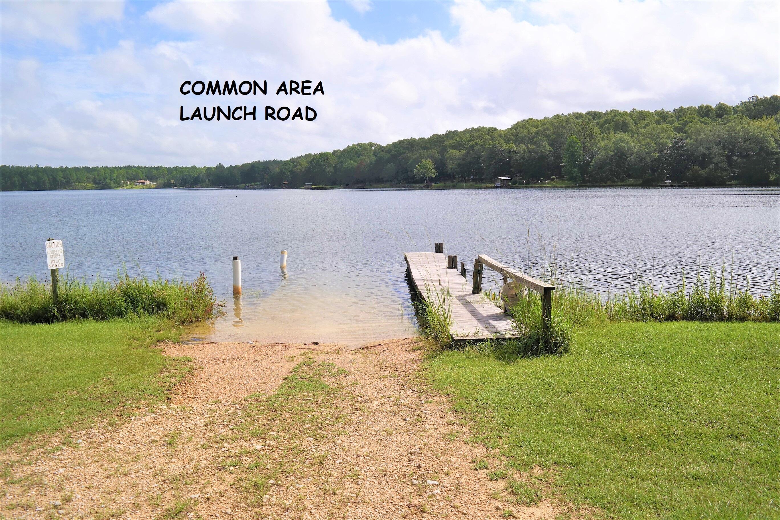 914 Spring Lake Road DeFuniak Springs, FL 32433 - Photo 76 of 78 a view of a lake with a mountain in the back