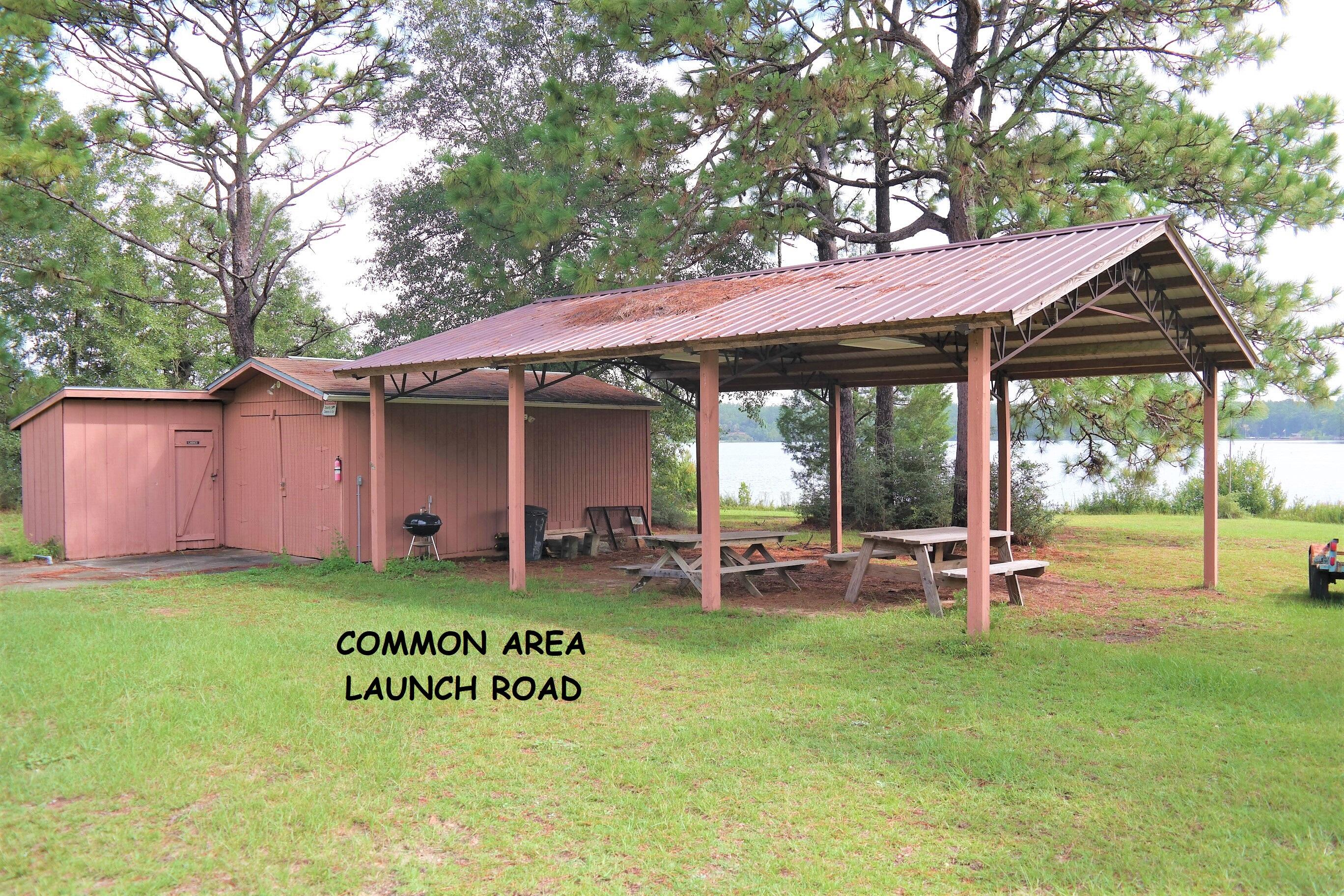 914 Spring Lake Road DeFuniak Springs, FL 32433 - Photo 78 of 78 a view of a house with a backyard porch and sitting area