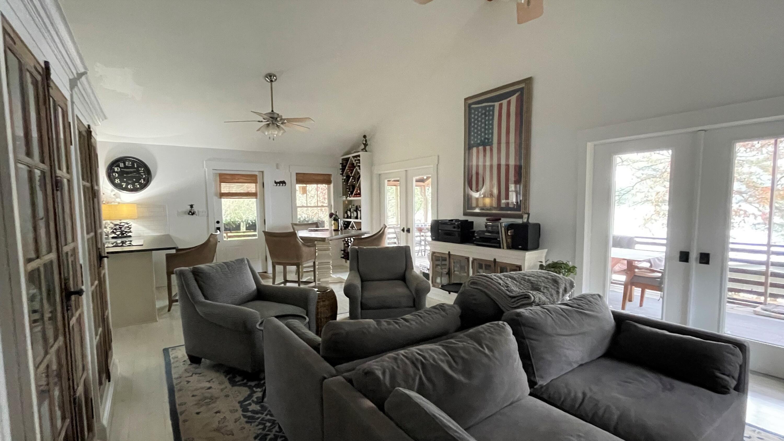 914 Spring Lake Road DeFuniak Springs, FL 32433 - Photo 9 of 78 a living room with furniture and a large window