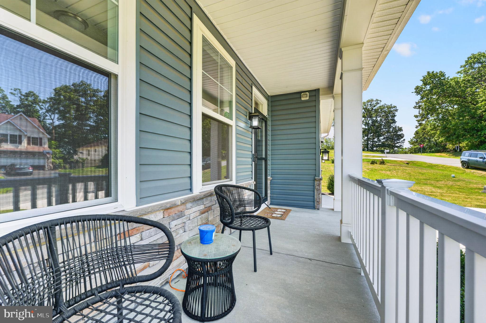 30 Range Road North East, MD 21901 - Photo 8 of 73 a view of a chair and tables in the balcony