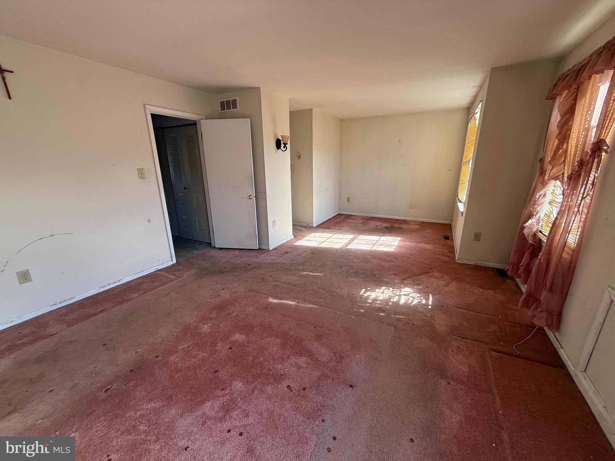 32 River Bank Drive Roebling, NJ 08554 - Photo 11 of 15 a view of empty room with window and stairs