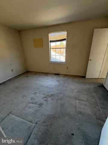 a view of a room that has a window in it