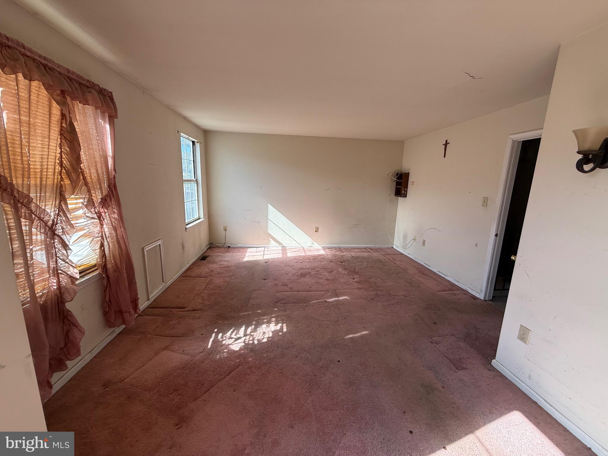 32 River Bank Drive Roebling, NJ 08554 - Photo 10 of 15 a view of empty room with wooden floor and fan
