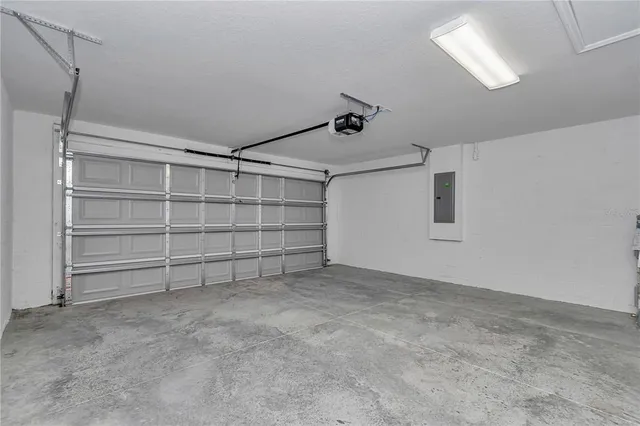 a view of an empty room with closet and racks