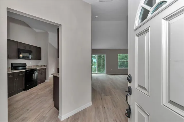 a view of a kitchen cabinets and wooden floor