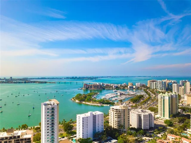 a view of swimming pool with outdoor seating and plants