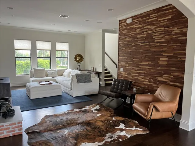 a living room with furniture and a rug