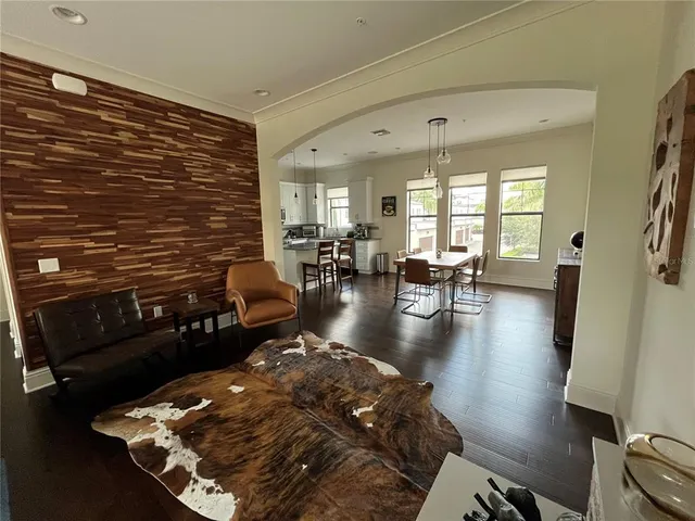 a living room with fireplace furniture and a wooden floor