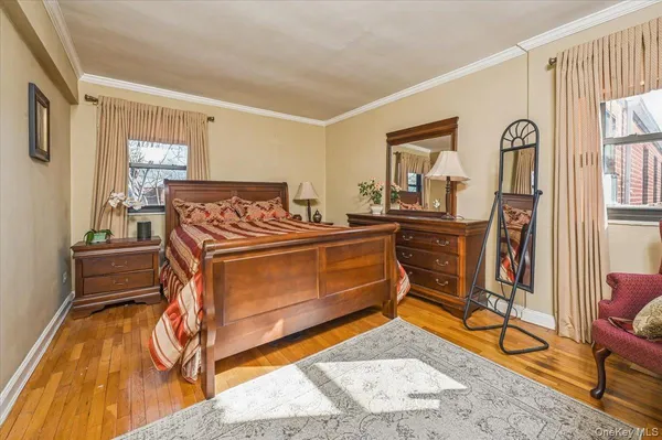 a bedroom with furniture and a window