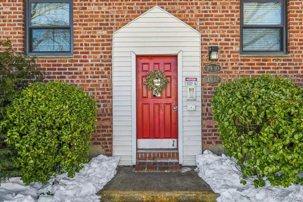 a front view of a house with a garage