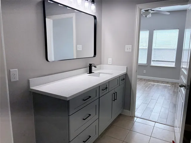 a bathroom with a sink and a mirror