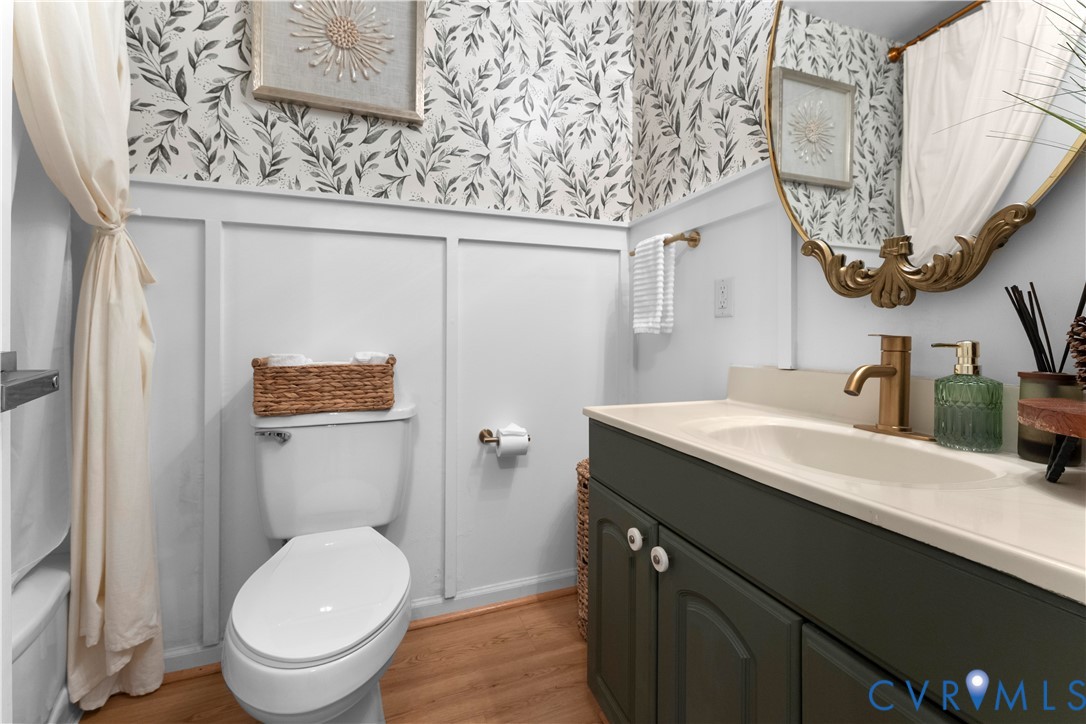 437 Plainview Road Kinsale, VA 22488 - Photo 28 of 63 a bathroom with a granite countertop sink a toilet and a mirror