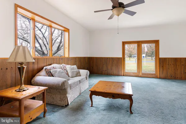 a living room with furniture and a window