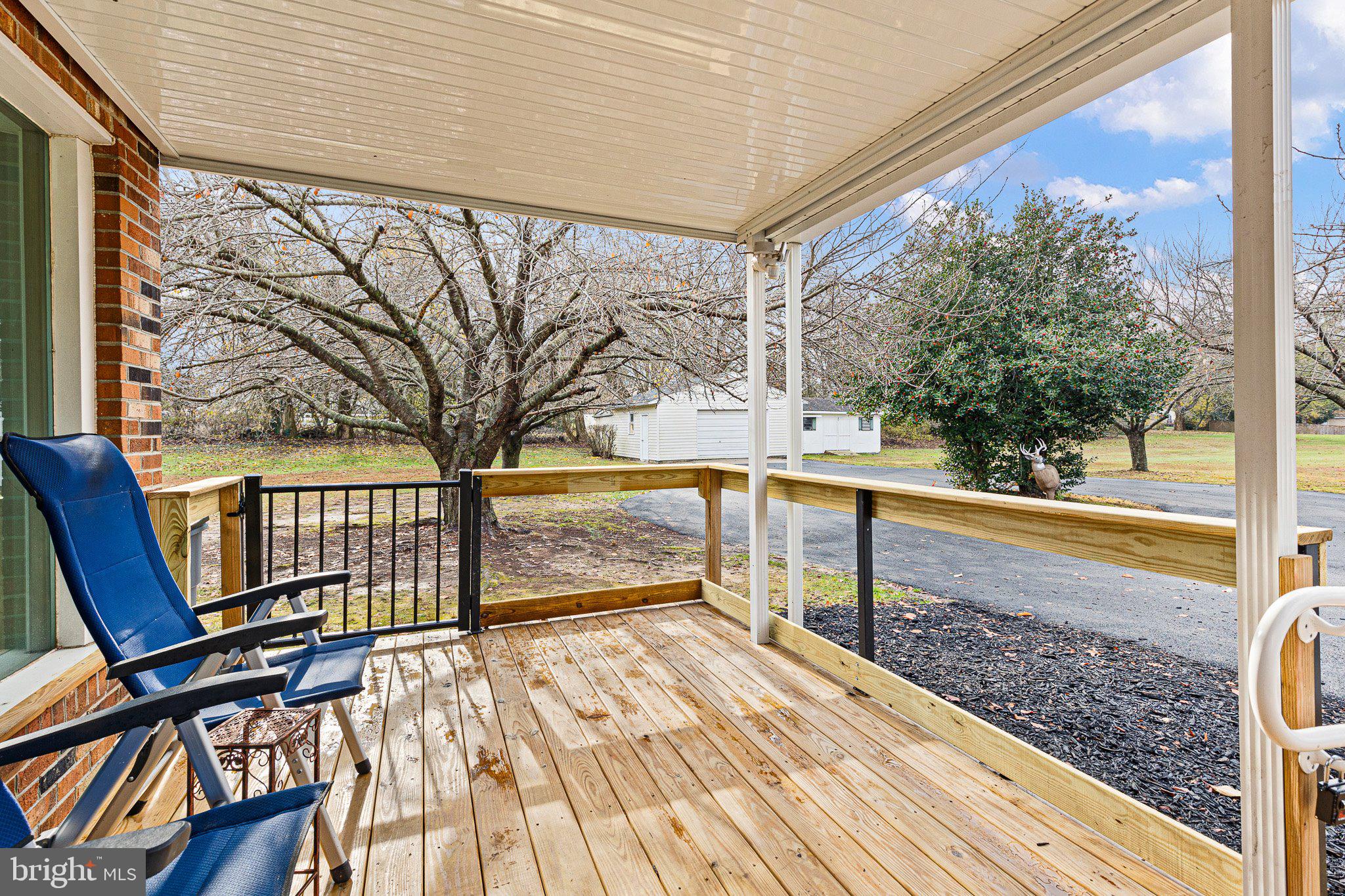 520 Chestnut Lane Townsend, DE 19734 - Photo 29 of 36 a view of a balcony with wooden floor and bench