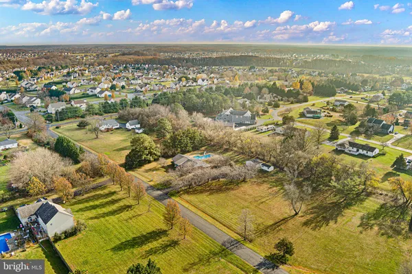 an aerial view of residential building with parking space