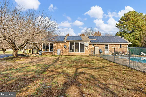a view of house with yard