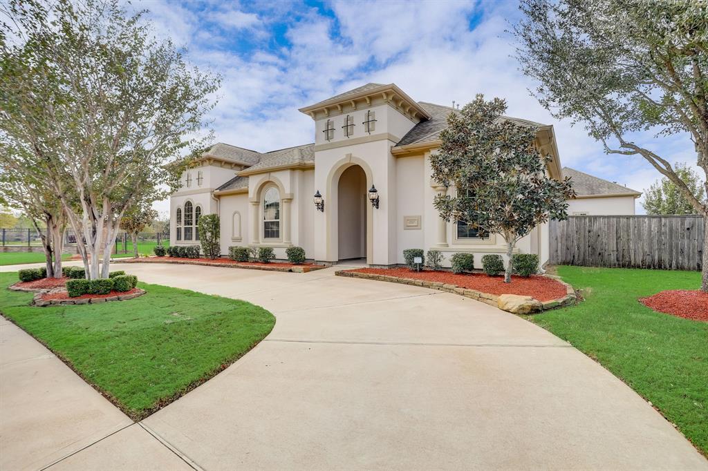 This is the curb appeal you want to greet your guest with. Pull through curved driveway, mature, easy care landscaping and beautiful detailed elevation.