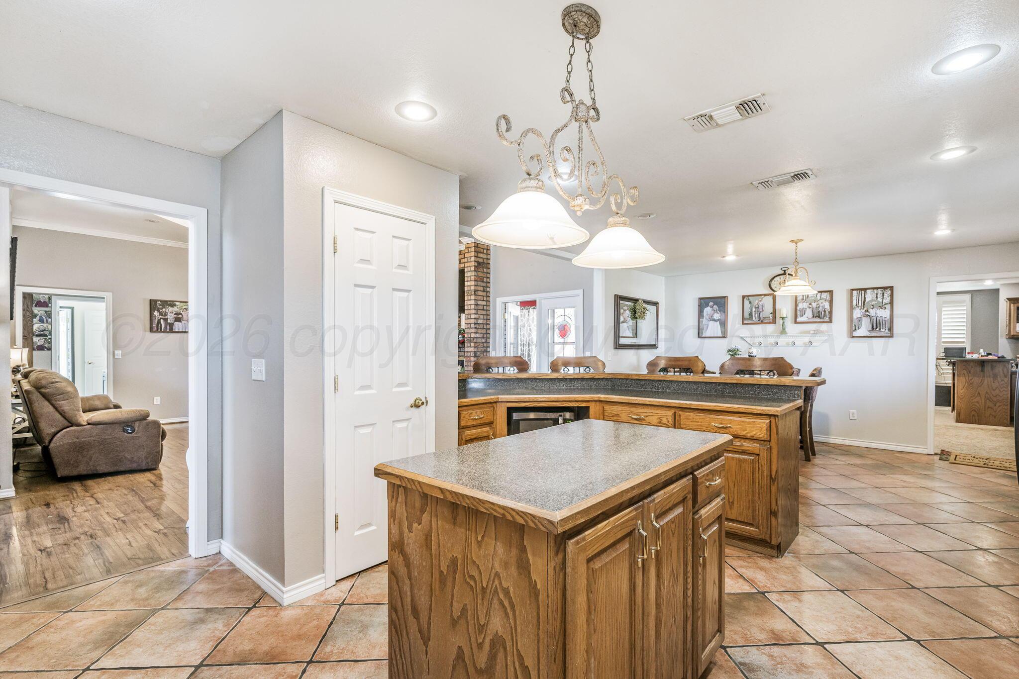 200 Hunters Trail Amarillo, TX 79124 - Photo 7 of 23 a view of a kitchen with a table and chairs