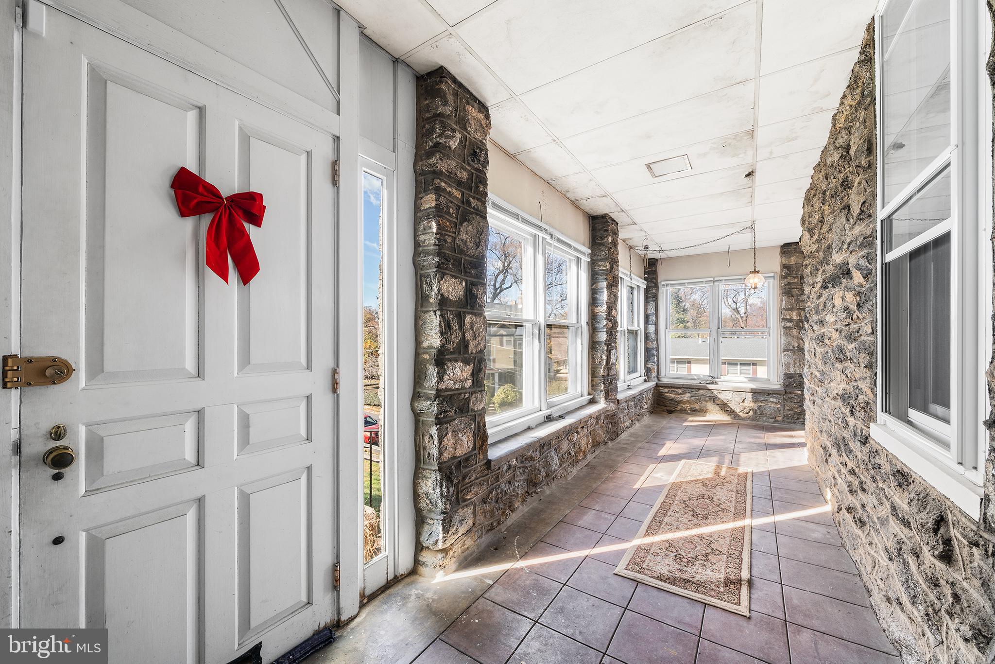 7301 Chestnut Avenue, Unit 1 Elkins Park, PA 19027 - Photo 14 of 22 a very nice looking room with a glass door