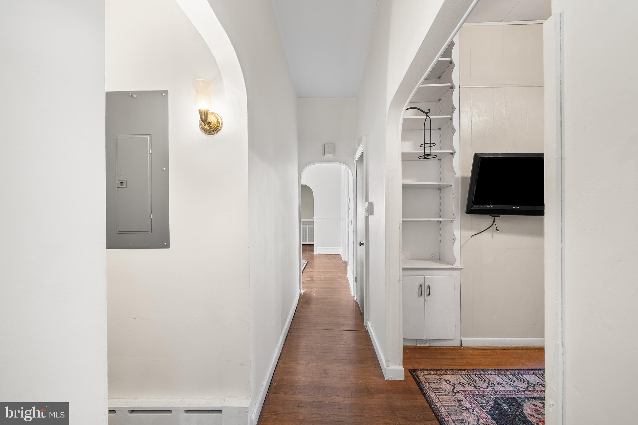 7301 Chestnut Avenue, Unit 1 Elkins Park, PA 19027 - Photo 4 of 22 a view of a hallway with wooden floor and staircase