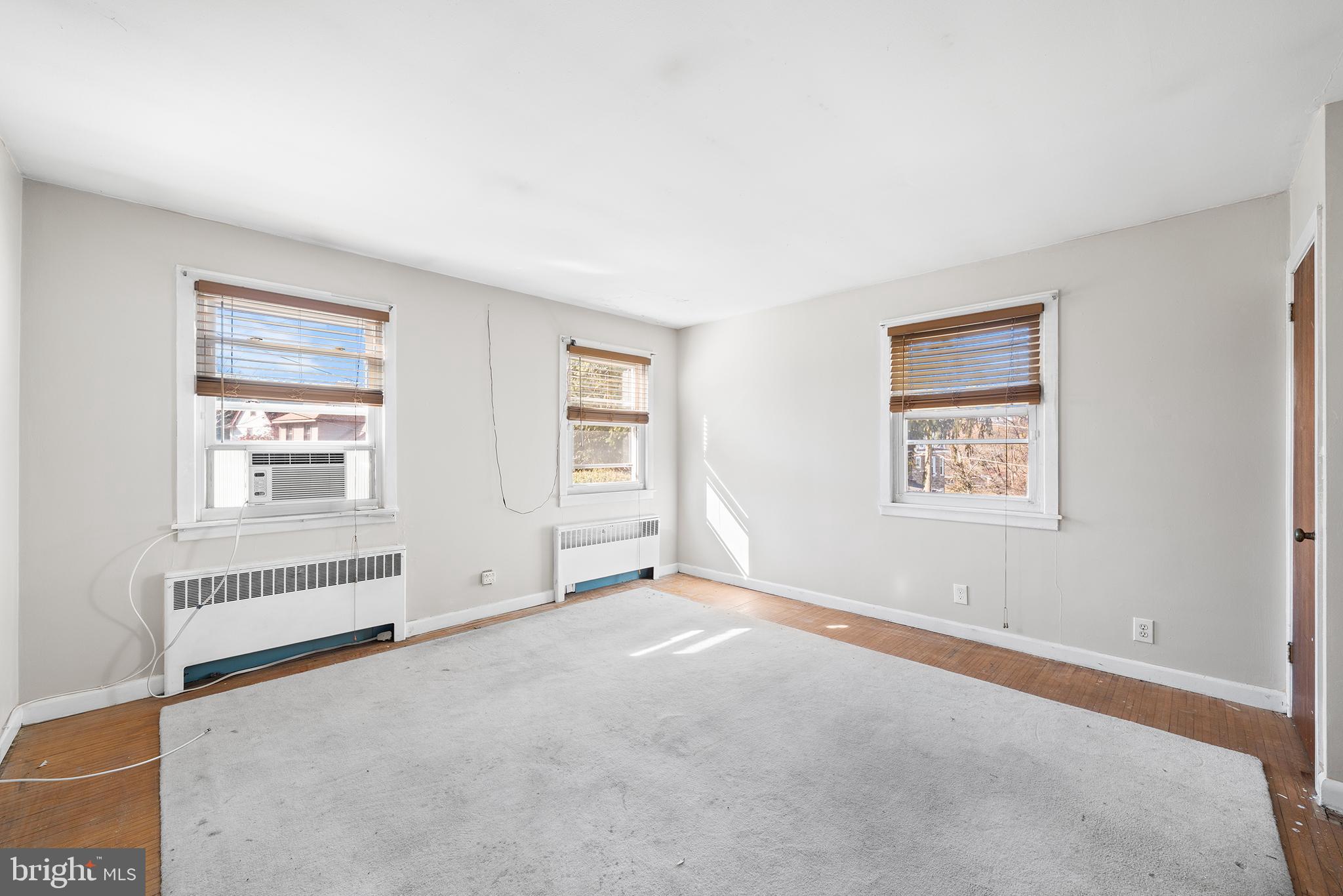 7301 Chestnut Avenue, Unit 1 Elkins Park, PA 19027 - Photo 8 of 22 an empty room with windows