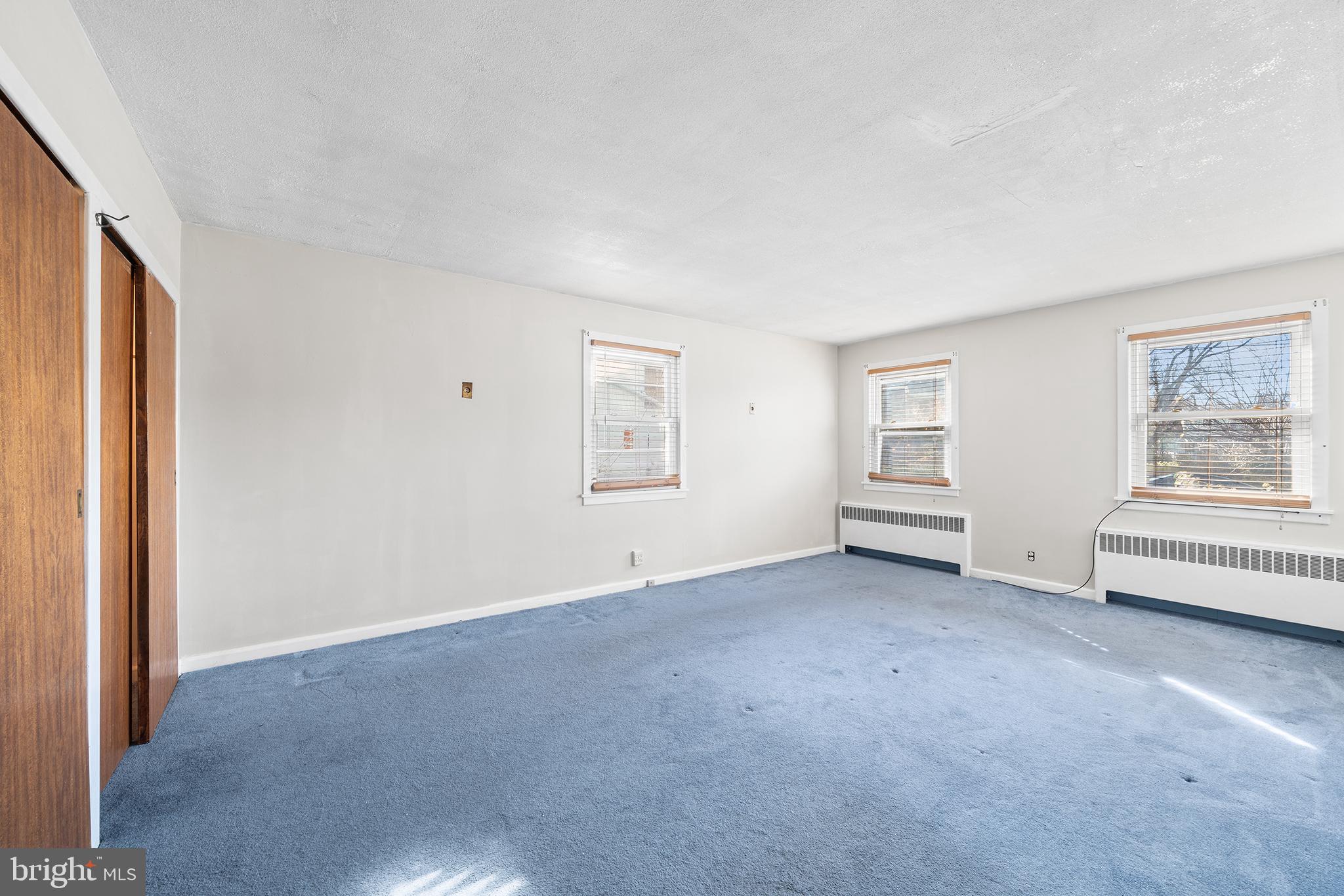 7301 Chestnut Avenue, Unit 1 Elkins Park, PA 19027 - Photo 9 of 22 an empty room with windows and closet