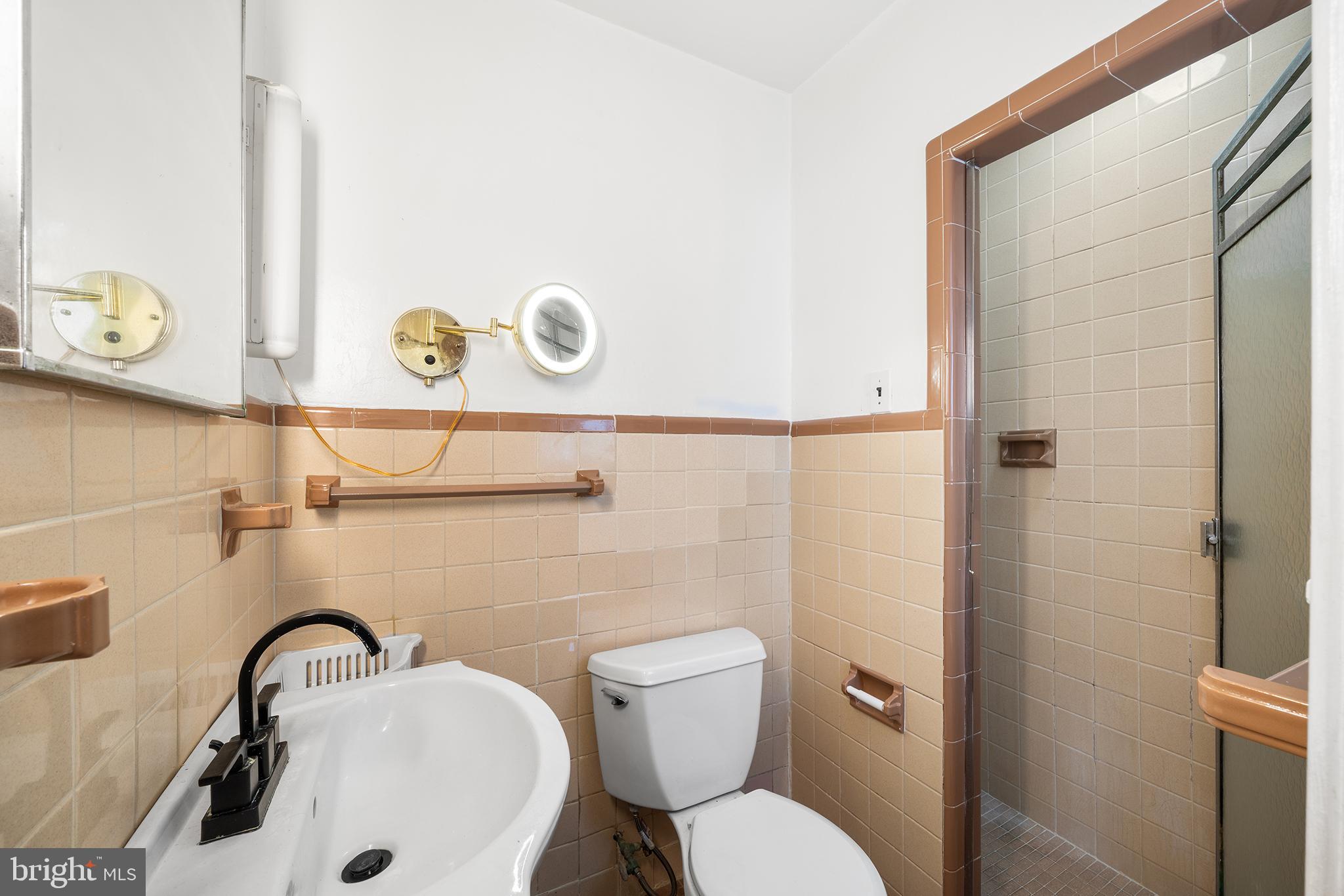 7301 Chestnut Avenue, Unit 1 Elkins Park, PA 19027 - Photo 10 of 22 a bathroom with a sink and a toilet