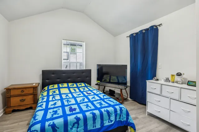 a bedroom with a bed and furniture