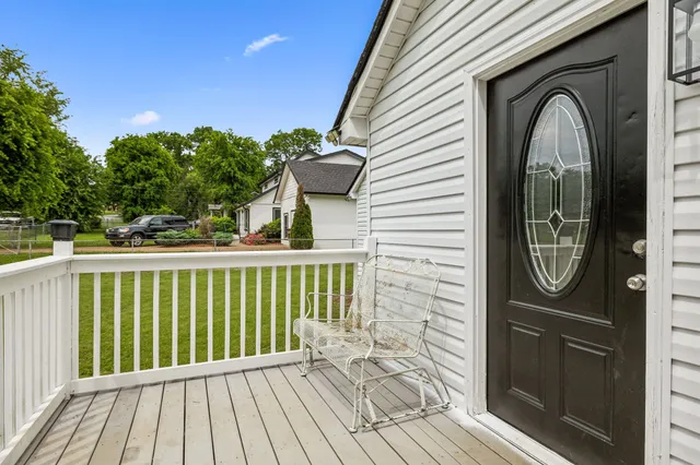 a view of a balcony with wooden floor