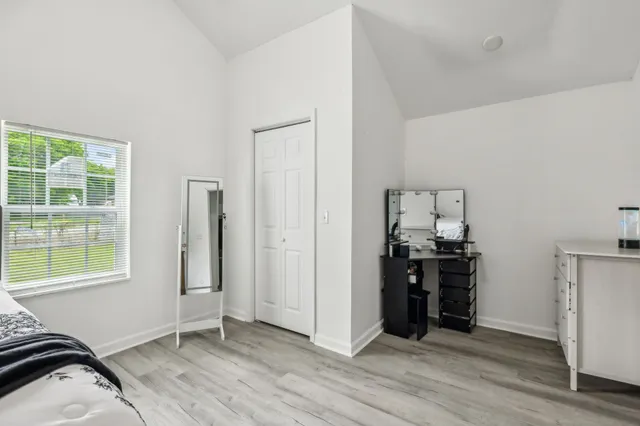 a view of a livingroom with a kitchen