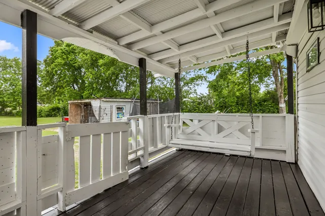 a view of balcony with wooden floor