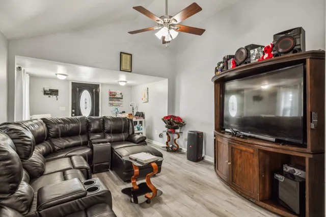 a living room with furniture and a flat screen tv
