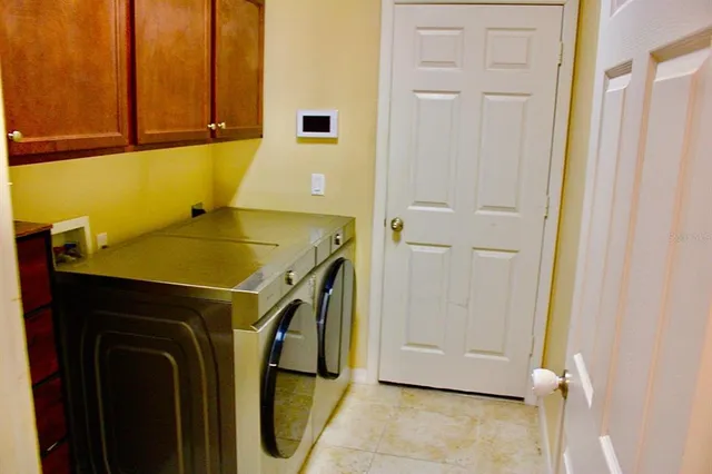 a utility room with dryer and washer