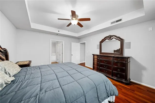 a bedroom with a bed and a dresser