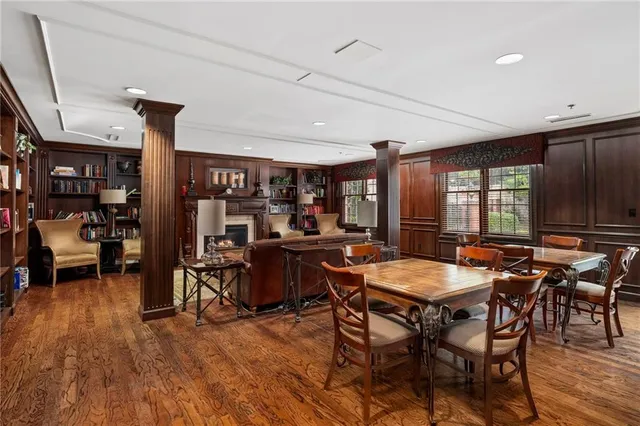 a view of a dining room with furniture window and wooden floor