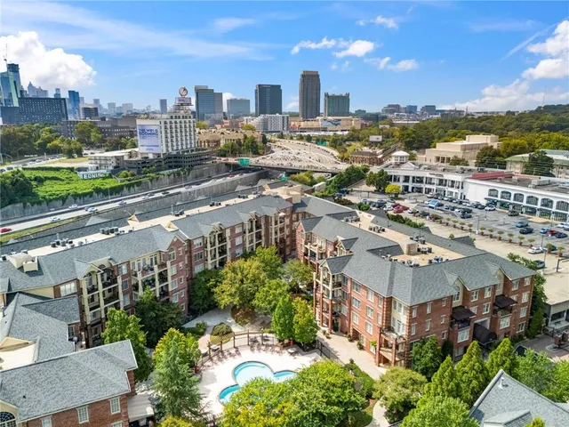 an aerial view of a house with yard swimming pool and outdoor seating